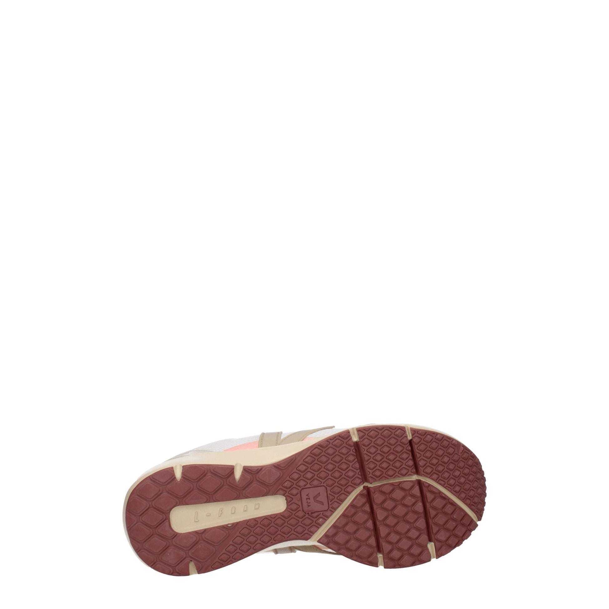 Red and white athletic shoe with a textured sole