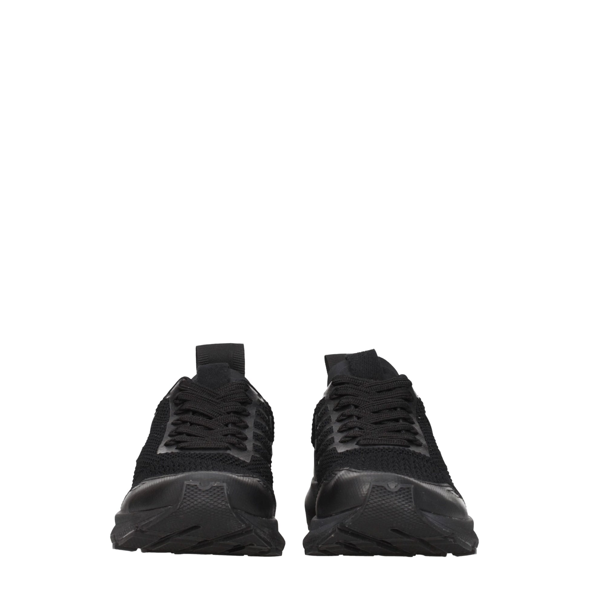 Pair of black athletic sneakers with white soles