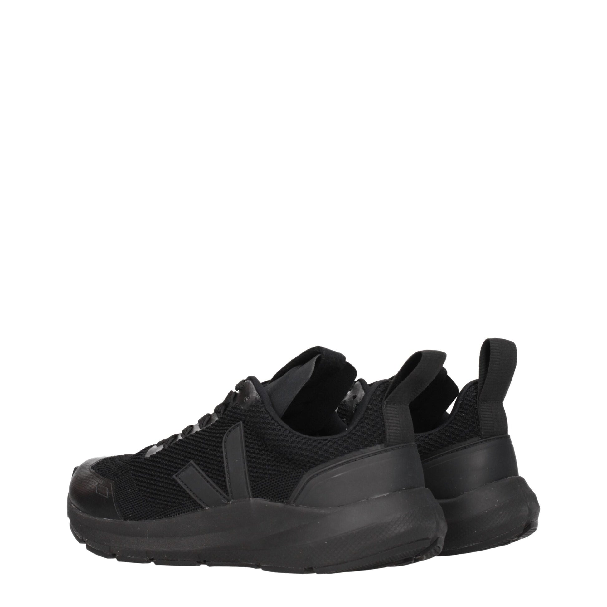 Pair of black athletic sneakers with white sole