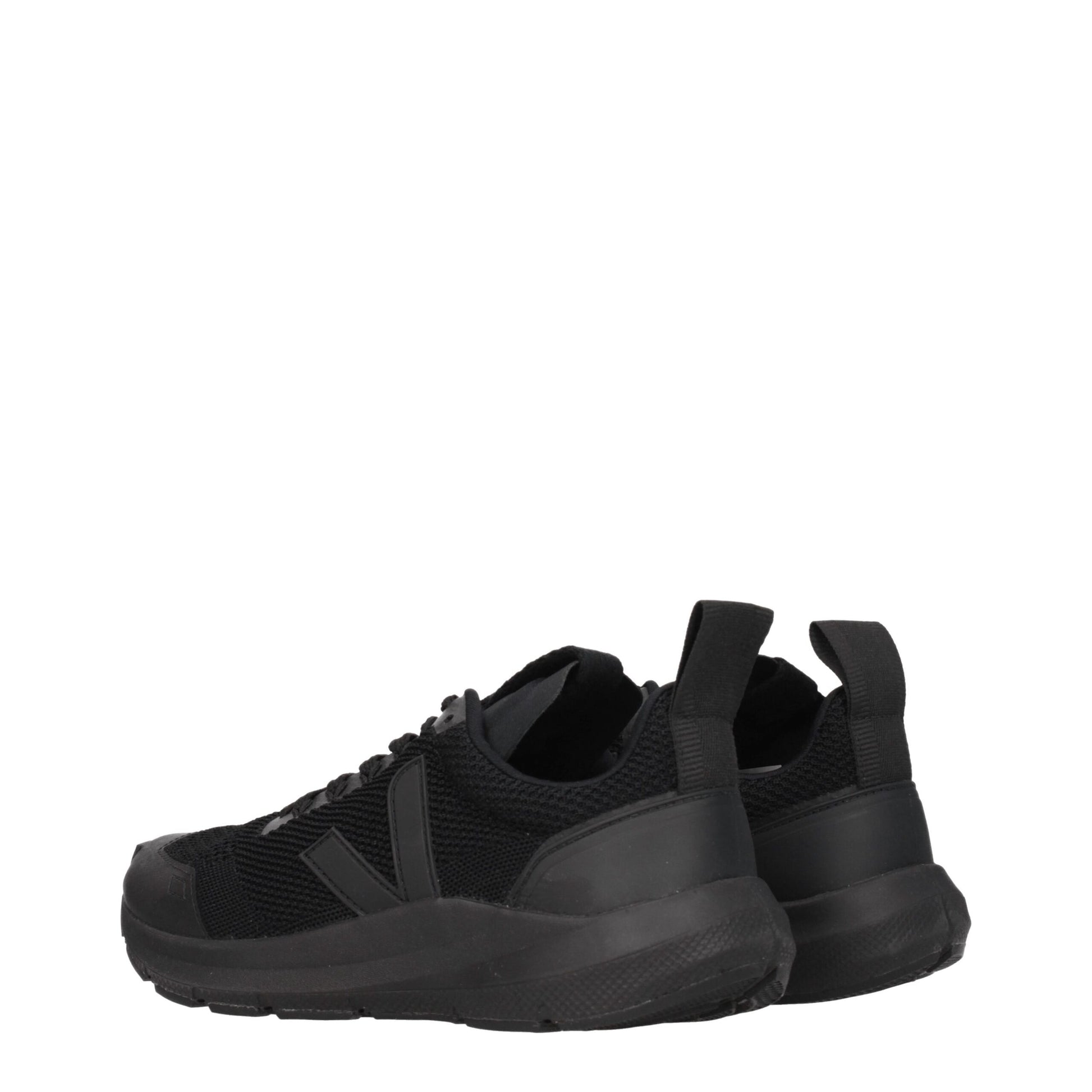 Pair of black athletic sneakers with laces, featuring a knit upper and a chunky sole design