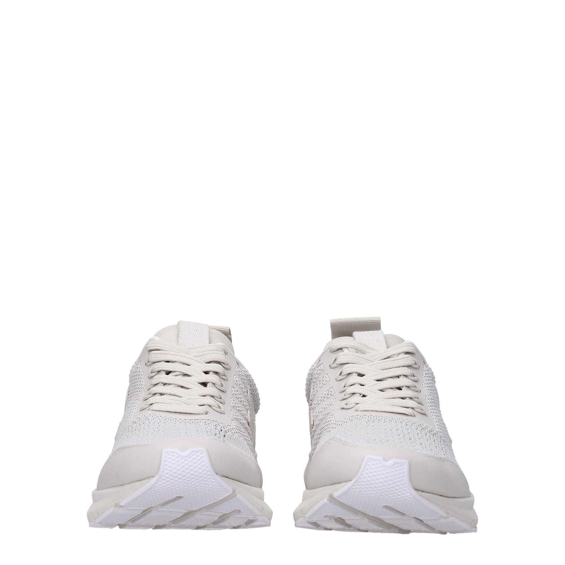 Pair of white sneakers with laces