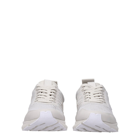 Pair of white sneakers with laces