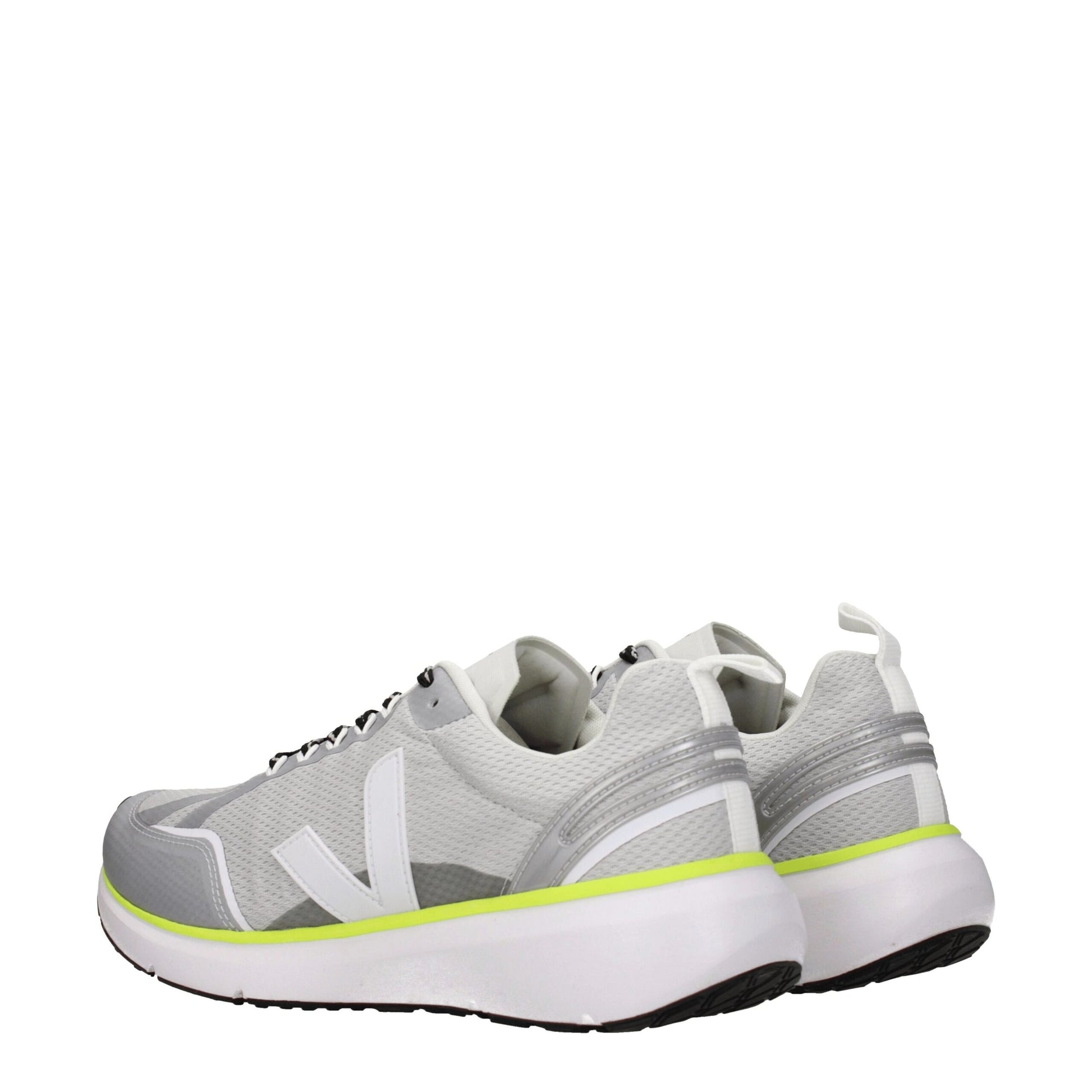 Pair of gray athletic sneakers with yellow accents, featuring a knit upper and a rubber sole