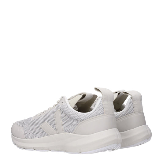 Pair of white sneakers with a mesh upper