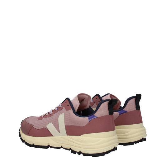 Pair of pink athletic sneakers with white soles