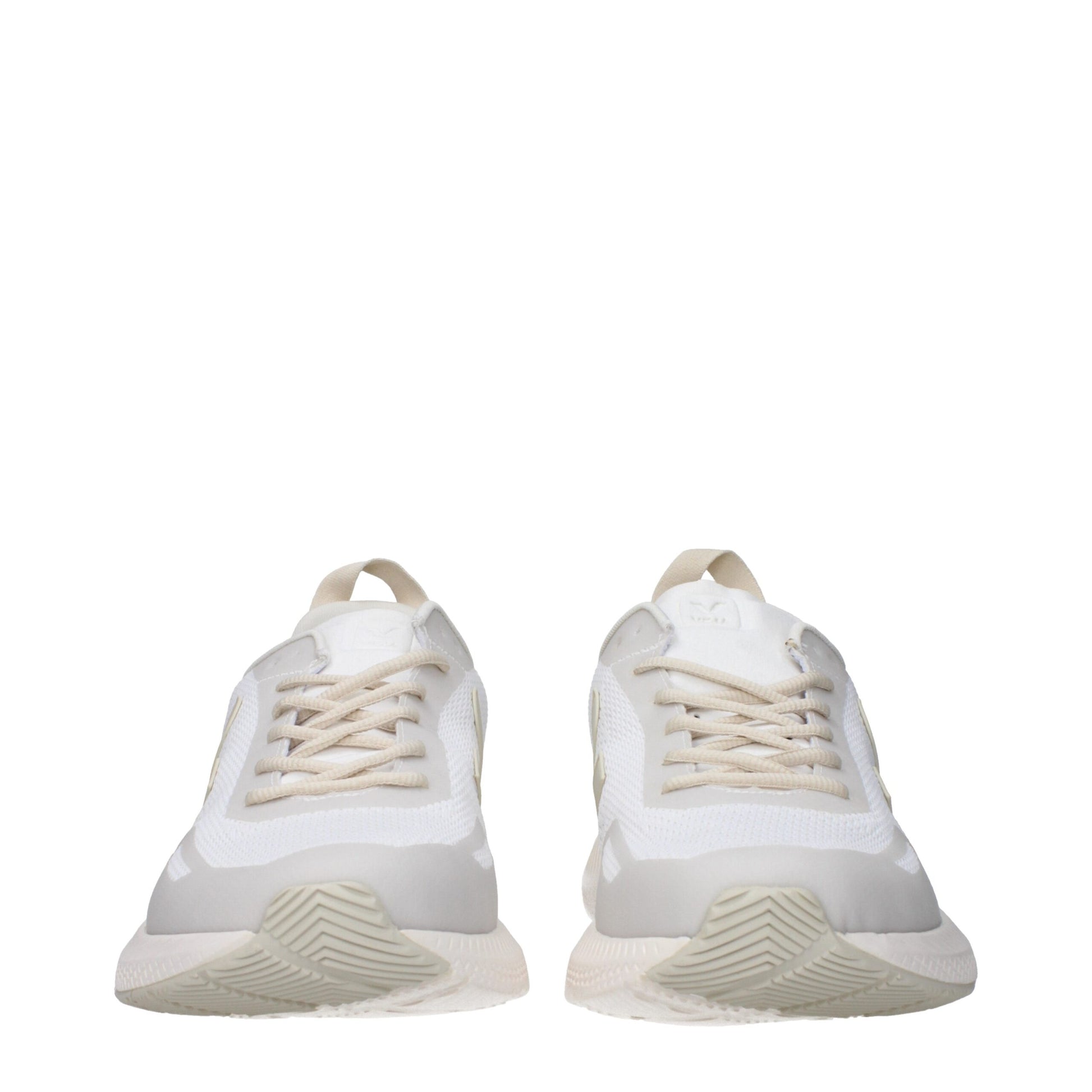 Pair of white athletic sneakers with laces, featuring a knit upper and a chunky sole design