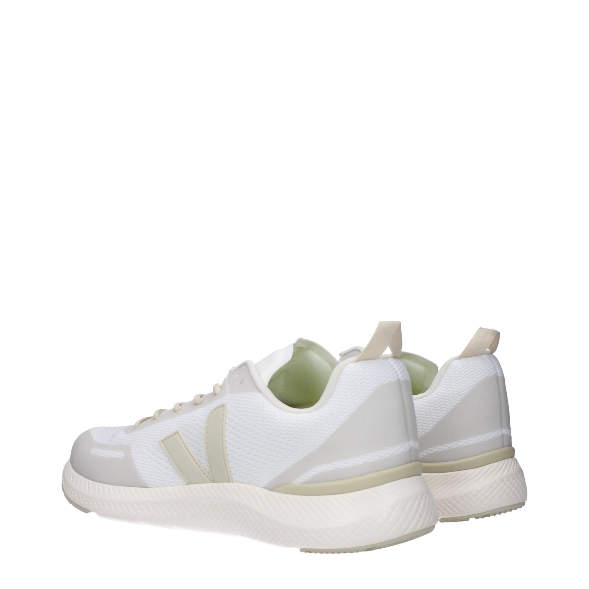 Pair of white athletic sneakers with tan laces and soles, featuring a knit upper and a textured sole