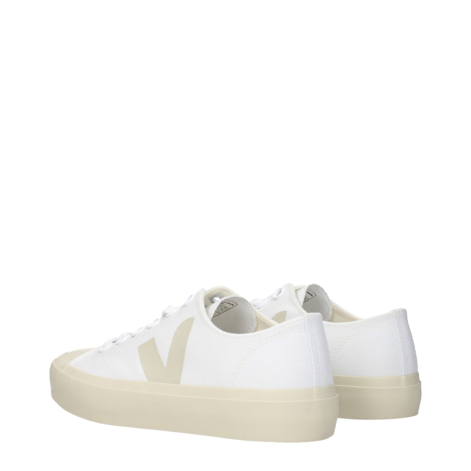 A pair of white sneakers with a low top design, featuring a fabric upper and a flat sole