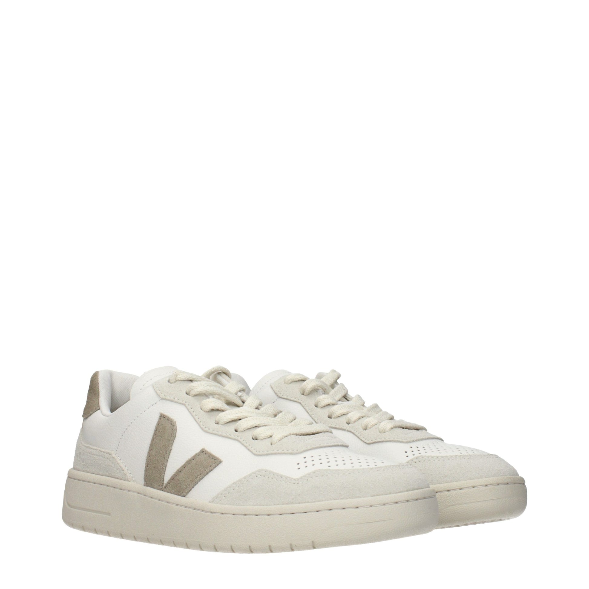 Tan leather low top sneakers with white laces, featuring a logo on the side and a flat sole