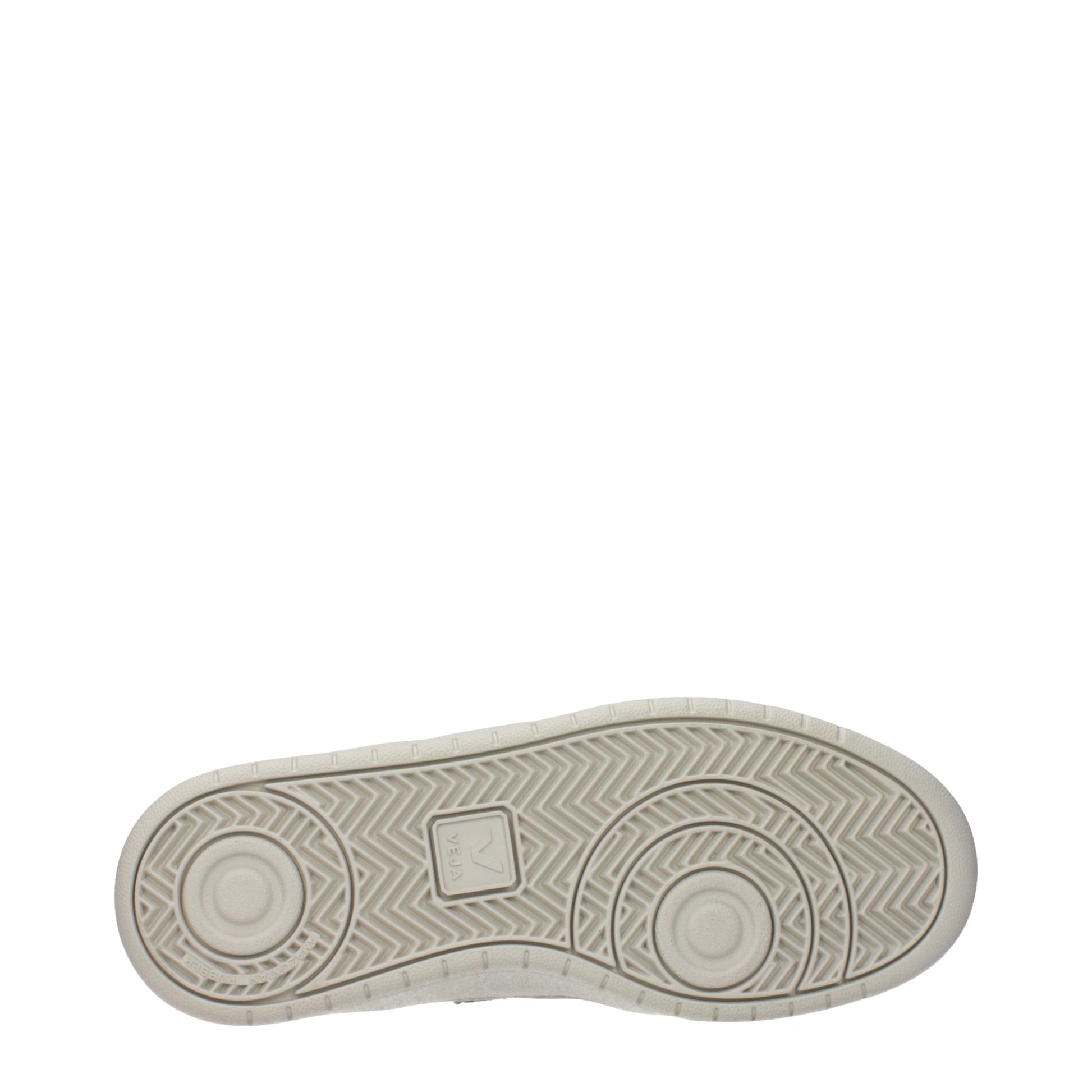 A single white leather low top sneaker with a textured sole