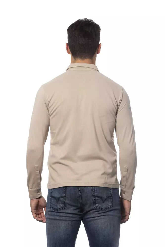 Man wearing tan jacket and blue jeans