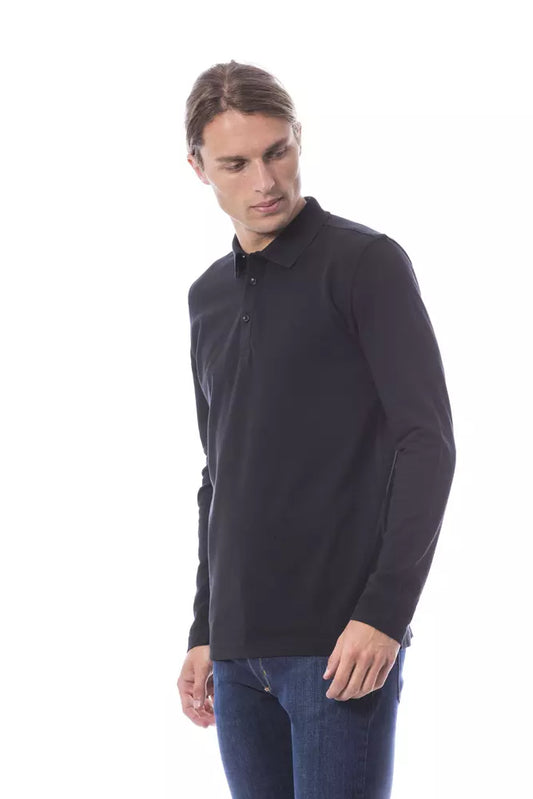 Man wearing black polo shirt and blue jeans