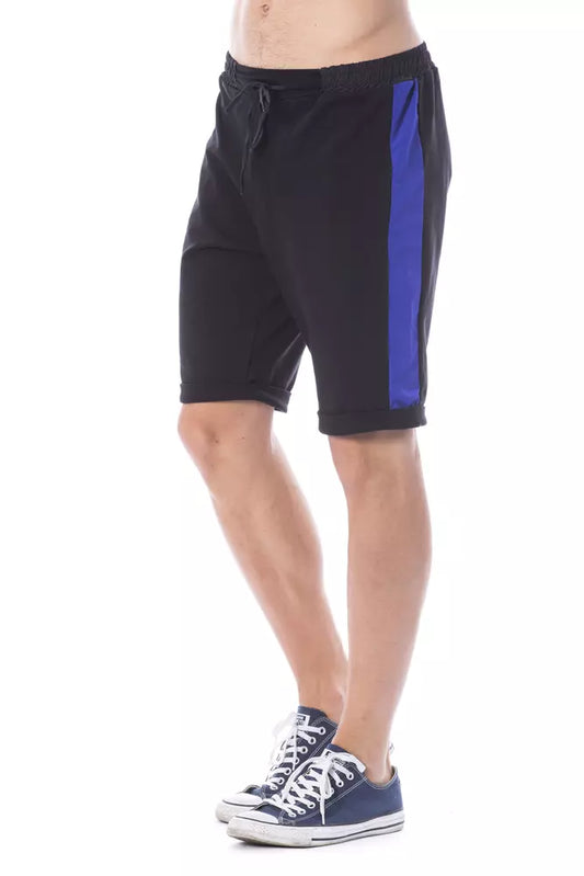 Man wearing blue shorts and white sneakers