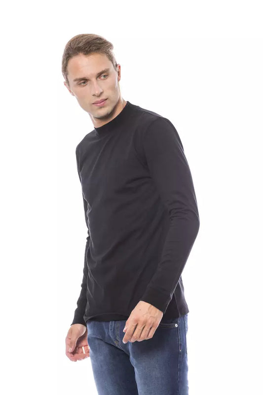 Man wearing black long sleeve shirt and blue jeans