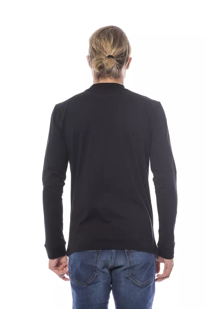 Black long sleeve shirt on a person standing against white background