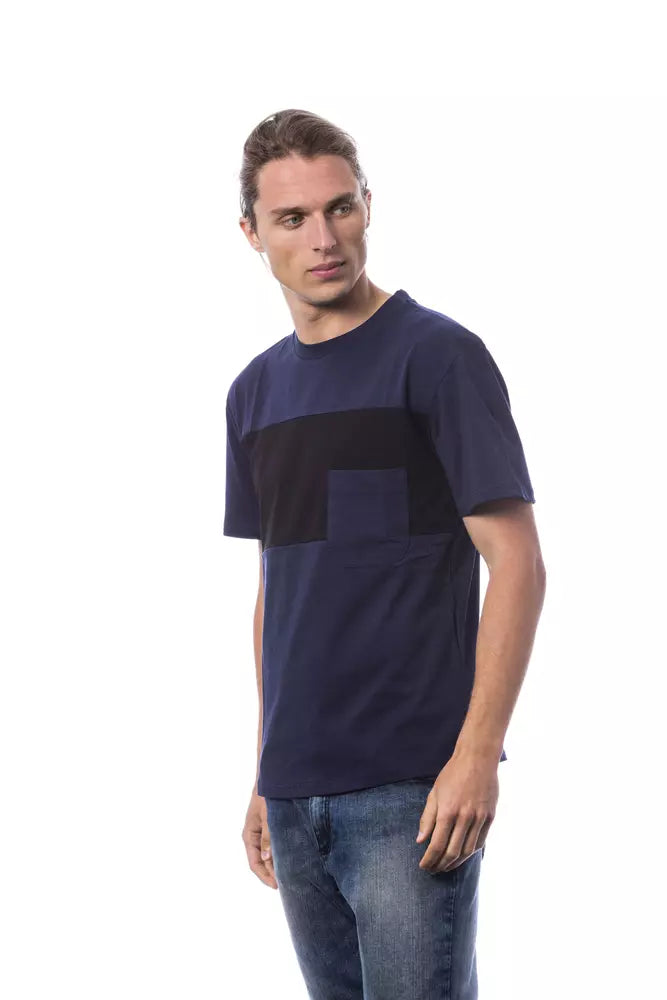 Man wearing blue t-shirt with black design on front