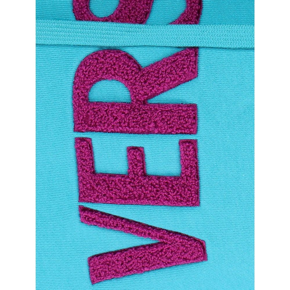 Pink embroidered letters on fabric