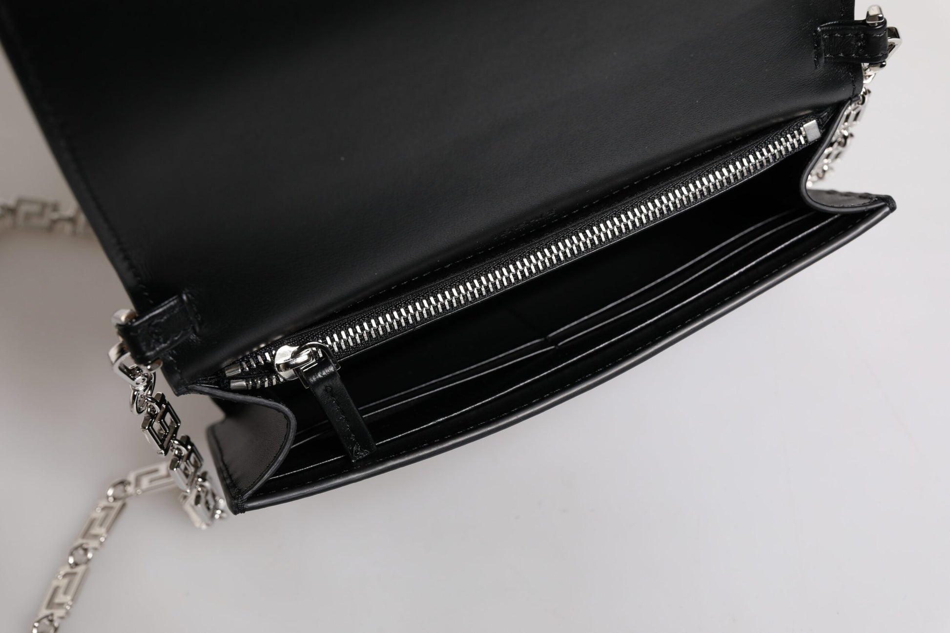 Black leather wallet with silver zipper pulls