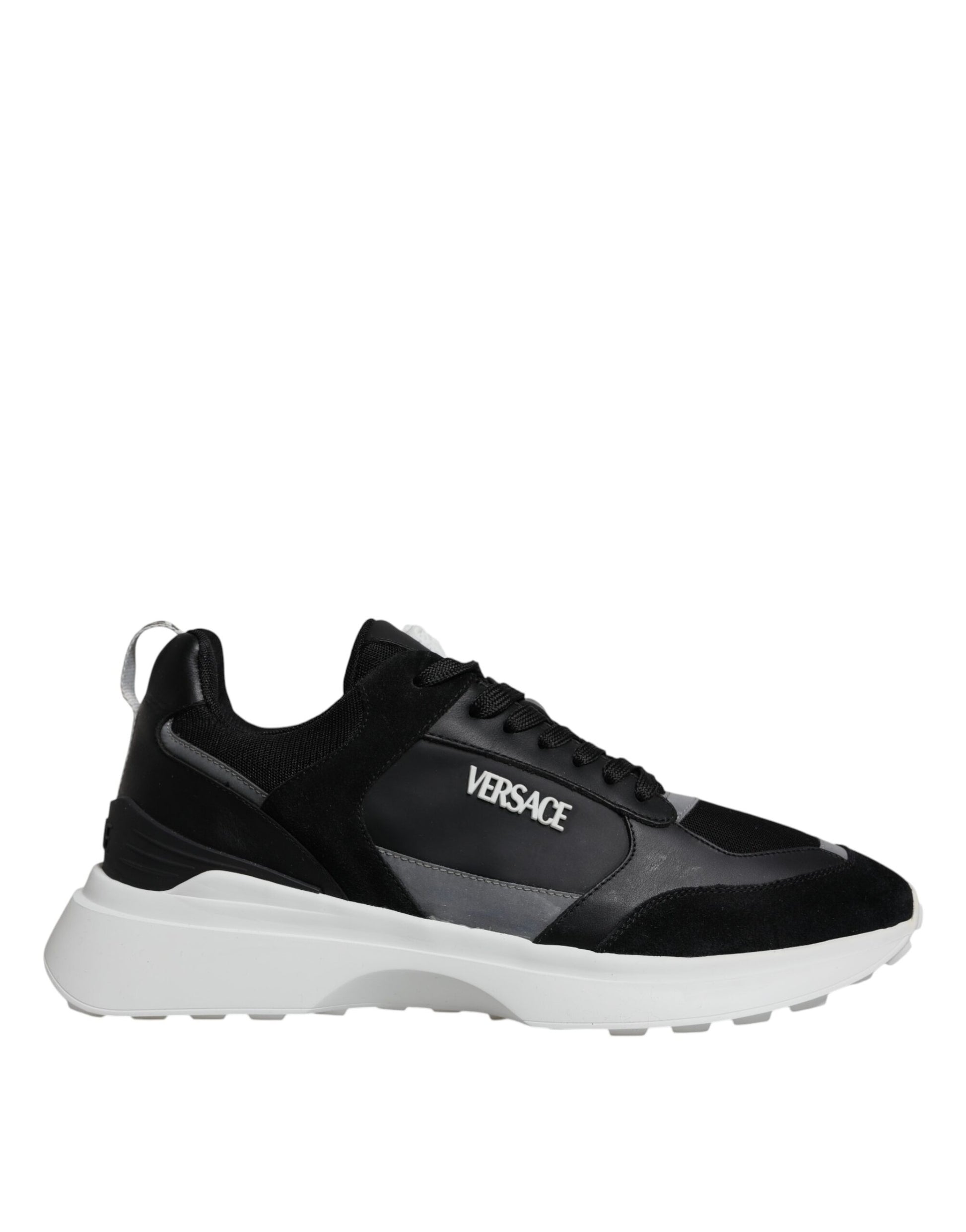 A pair of black canvas sneakers with white sole, featuring the Versace logo on side