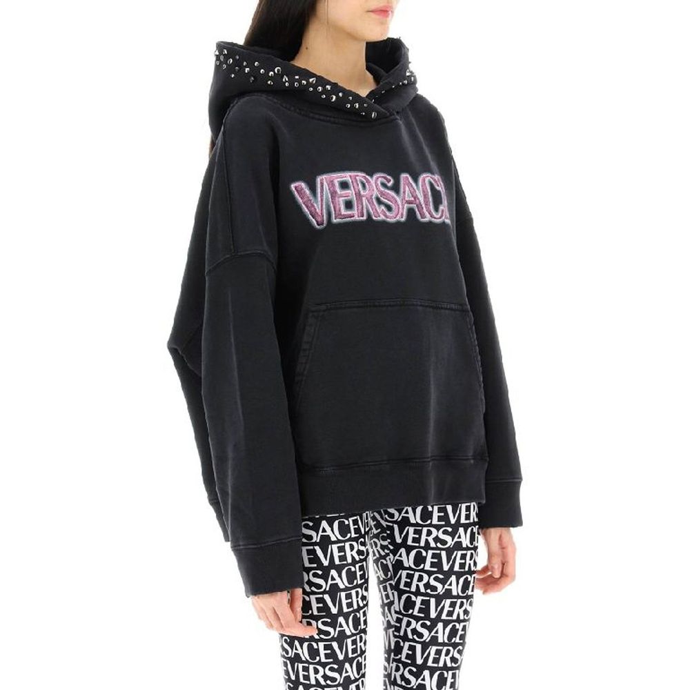 Black hoodie with pink writing on front