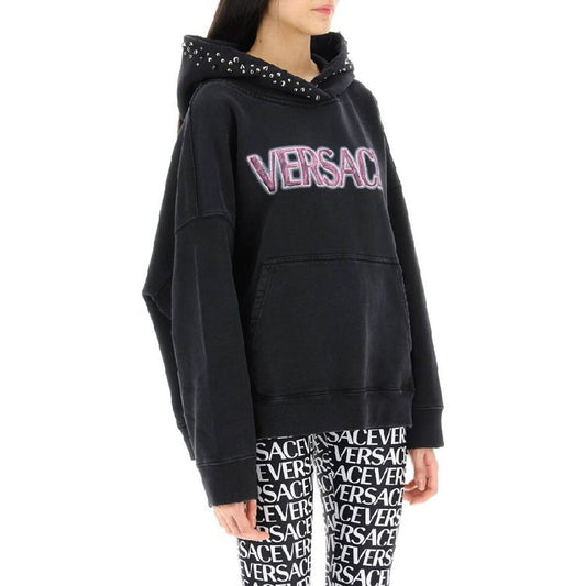 Black hoodie with pink writing on front