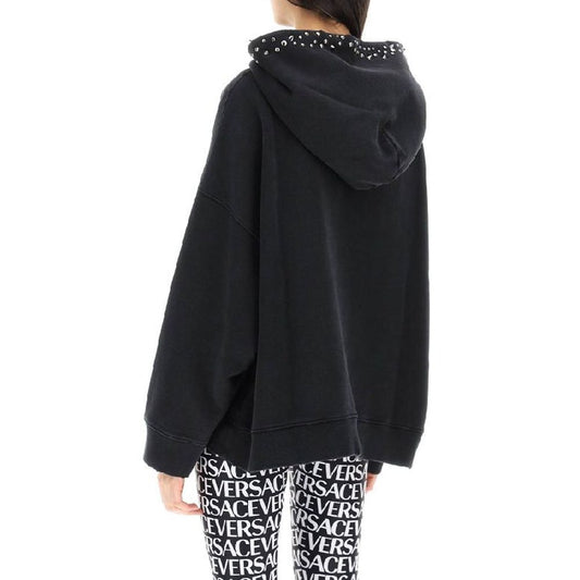 Black hoodie with white lettering on back