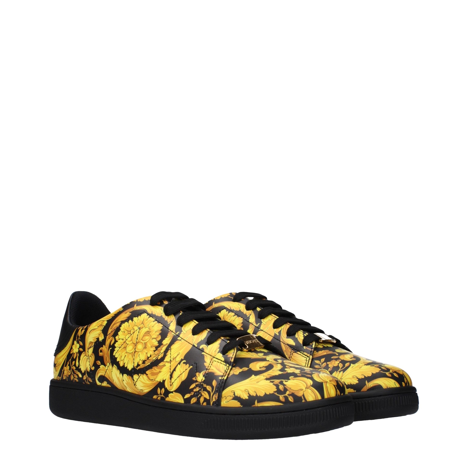 Yellow floral patterned sneakers with black laces, soles, and lining