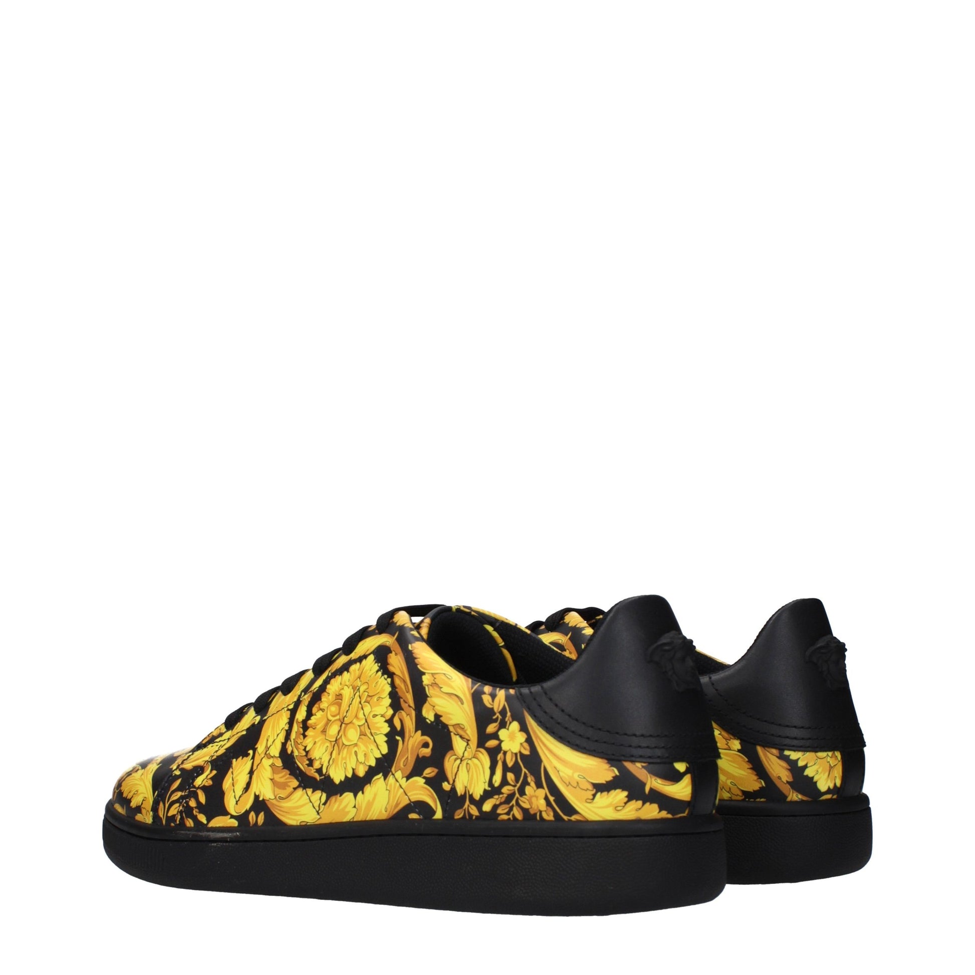 Yellow and black chunky sneakers with a floral pattern on the side