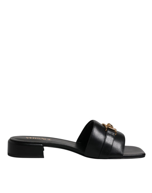 Black leather sandal with a strap over the foot