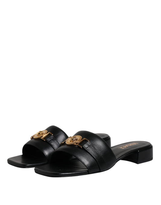 Black sandals with gold buckle