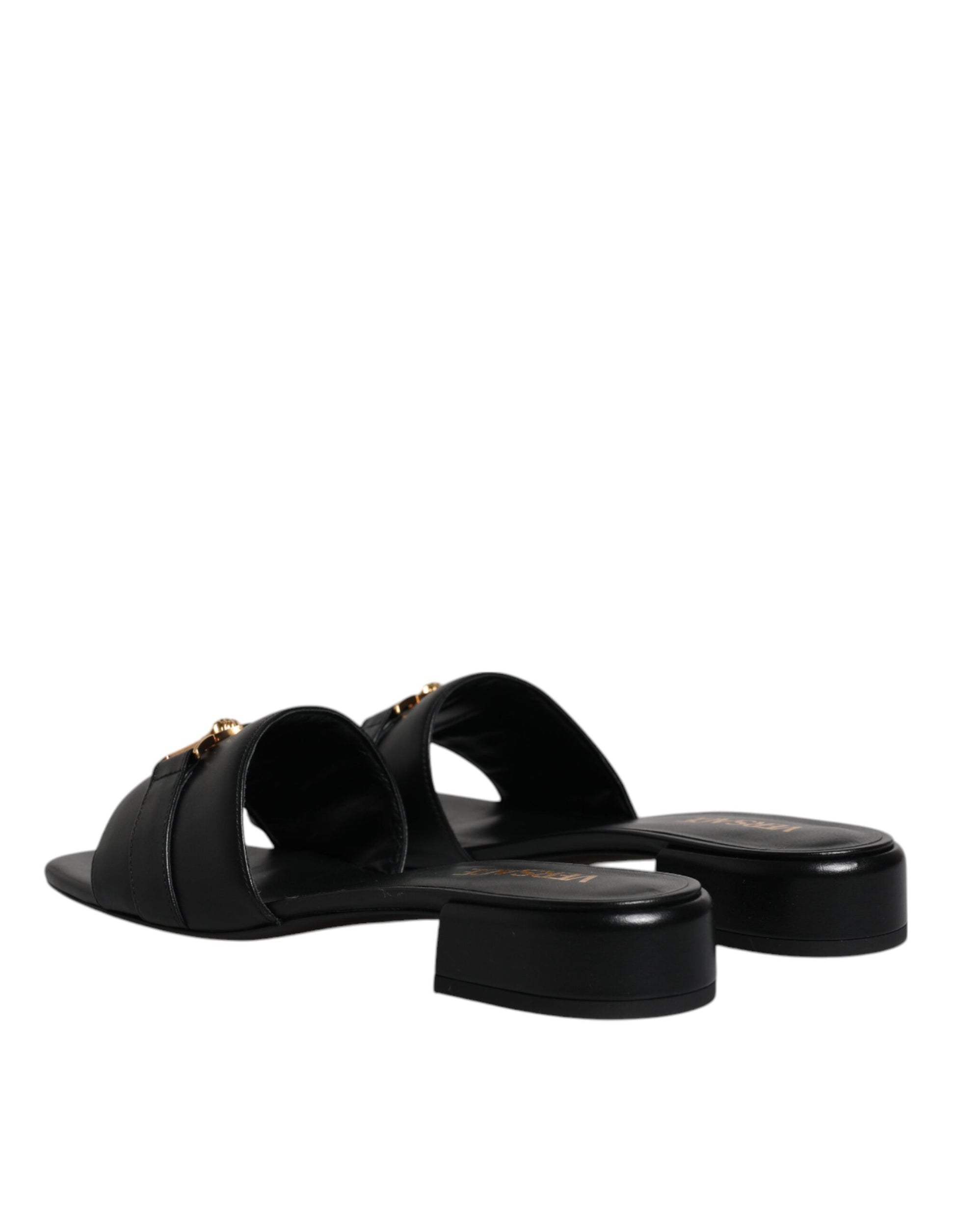 Pair of black sandals with a strap over the foot