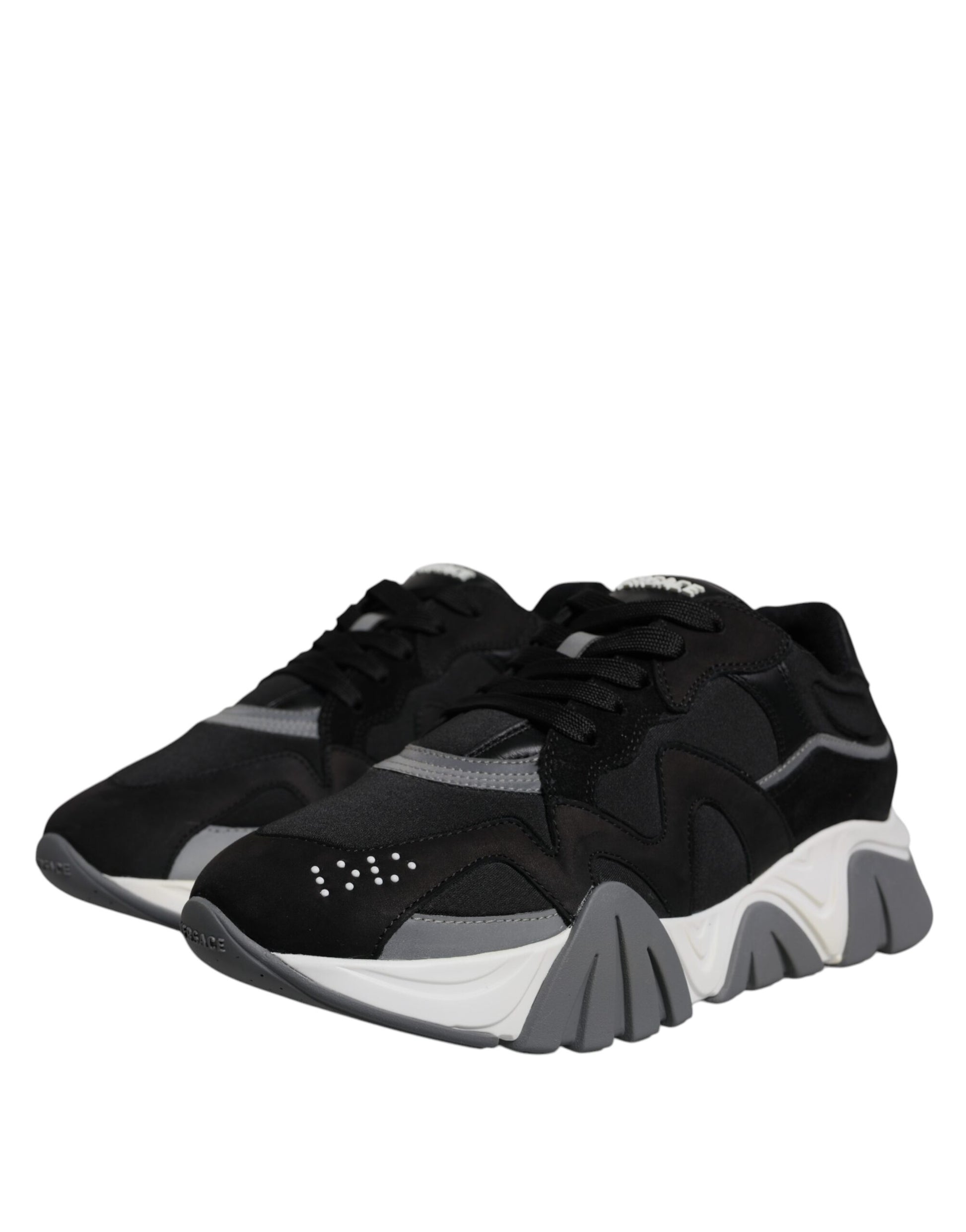 Pair of black and white sneakers with laces