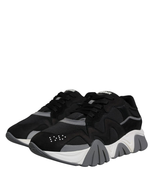 Pair of black and white sneakers with laces