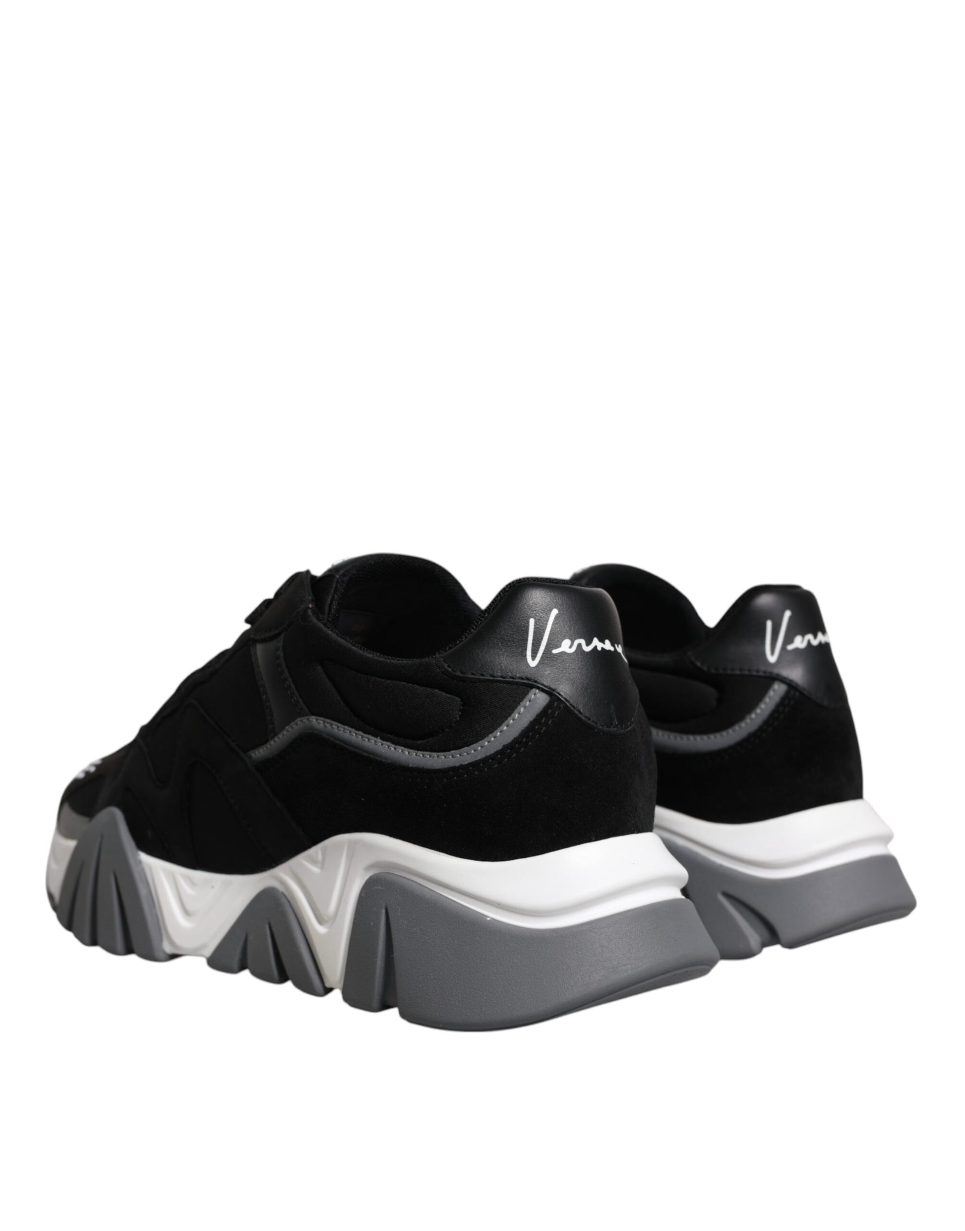 Pair of black and white sneakers with a logo on the side