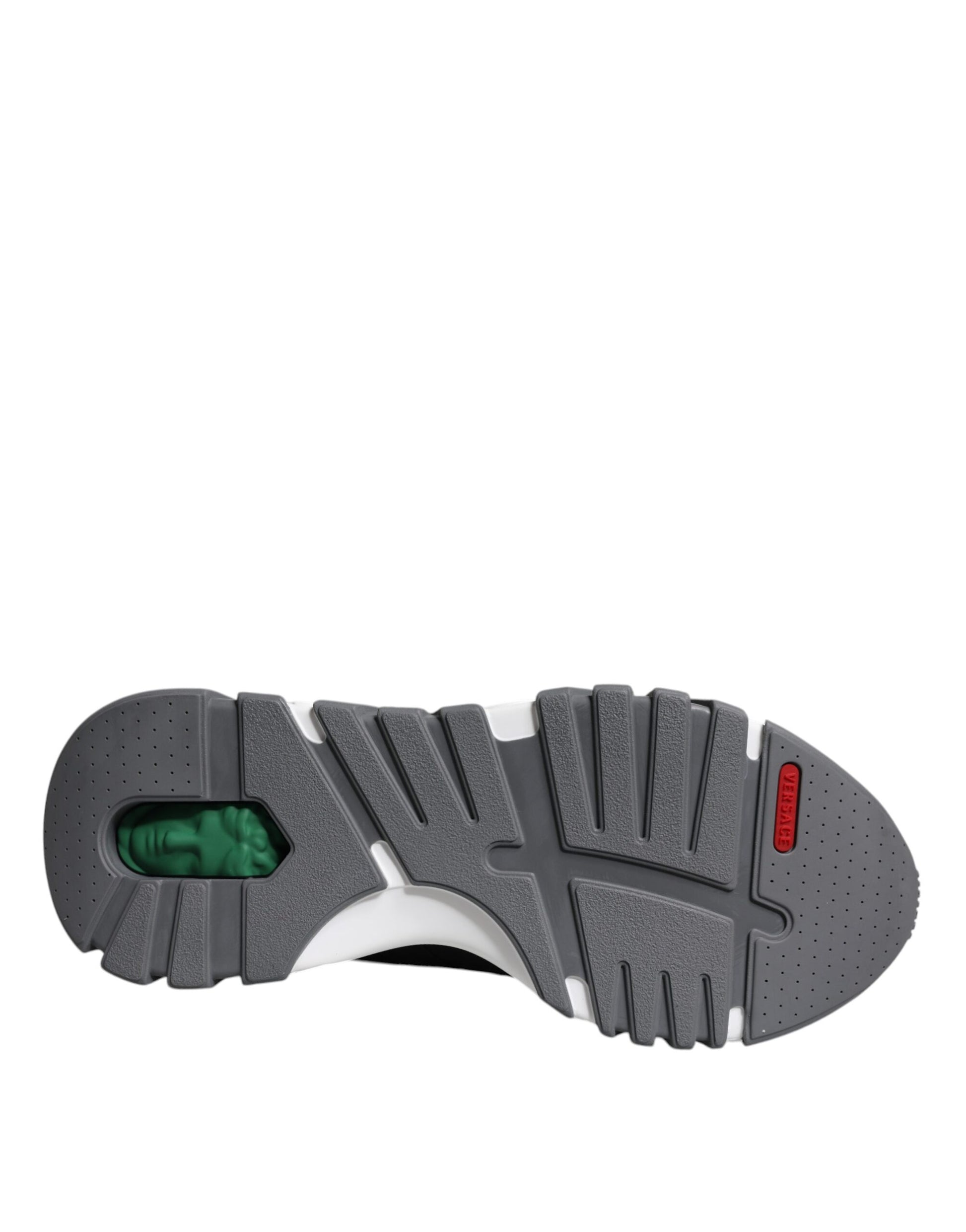 A single shoe against a plain background. It appears to be an athletic or running shoe with a gray upper and a white sole
