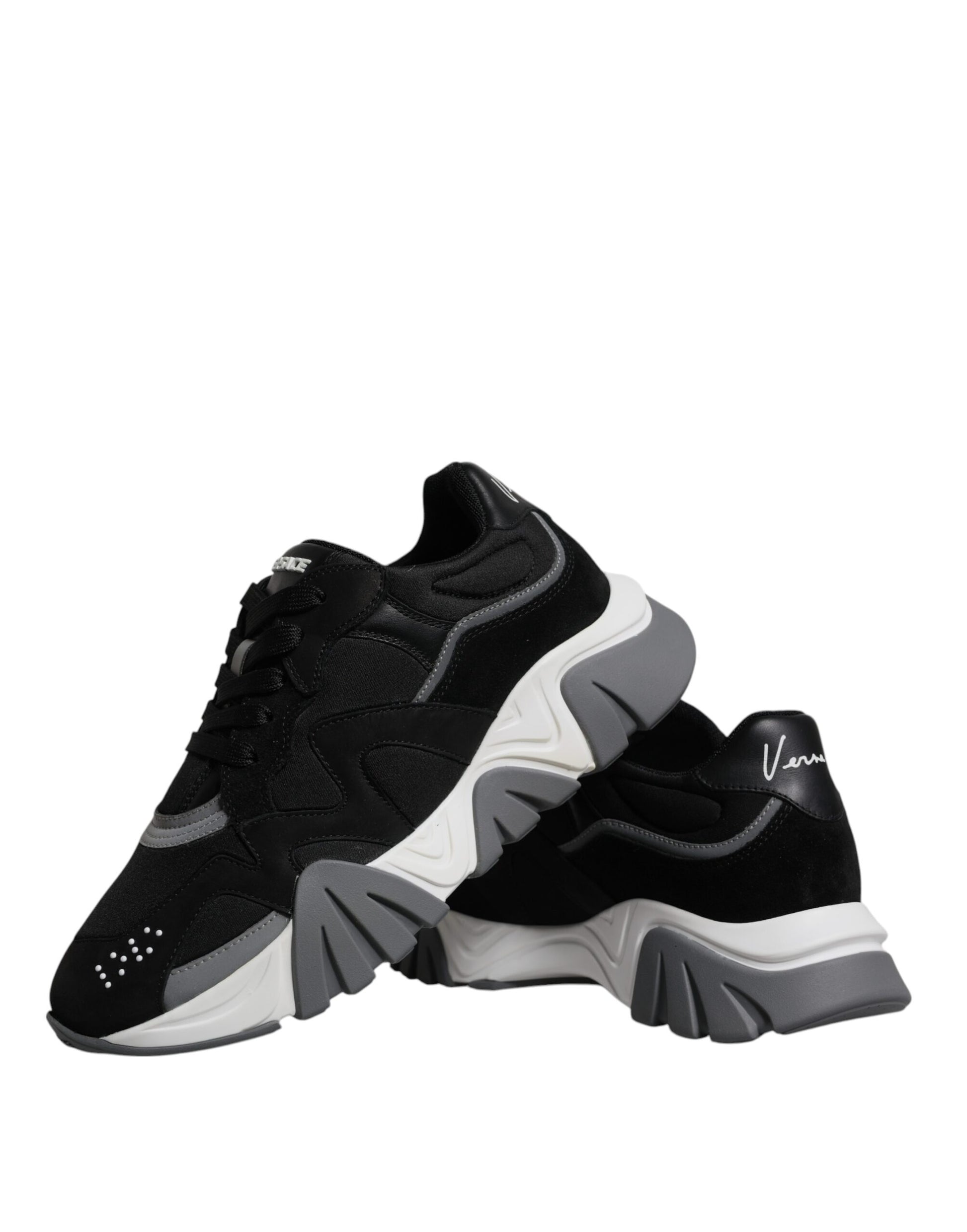 Pair of black and white sneakers with laces