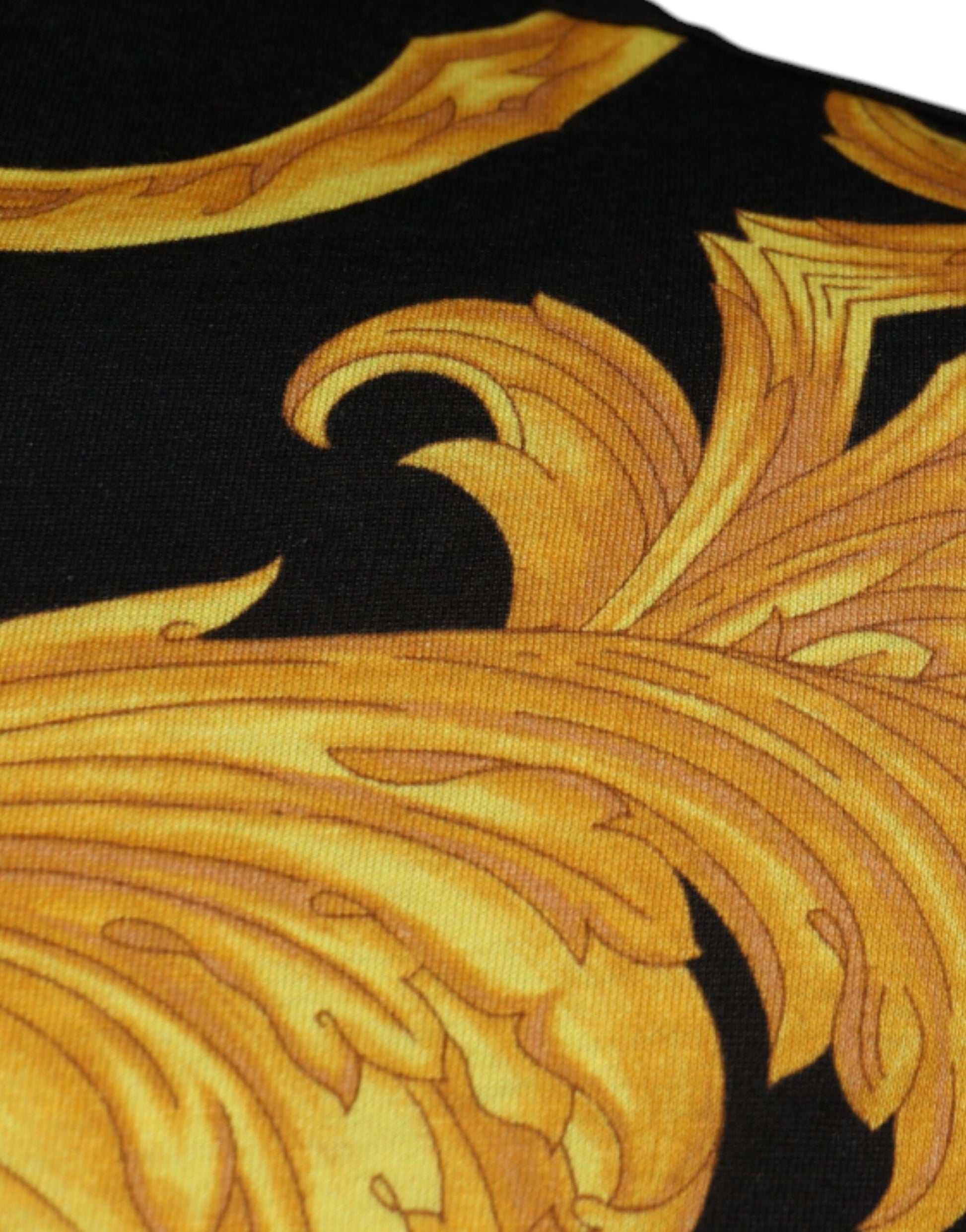 Decorative fabric with gold embroidery on black background