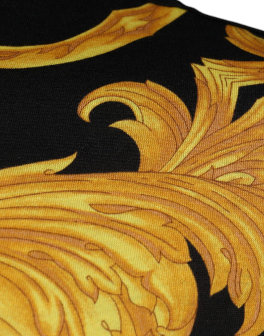 Decorative fabric with gold embroidery on black background