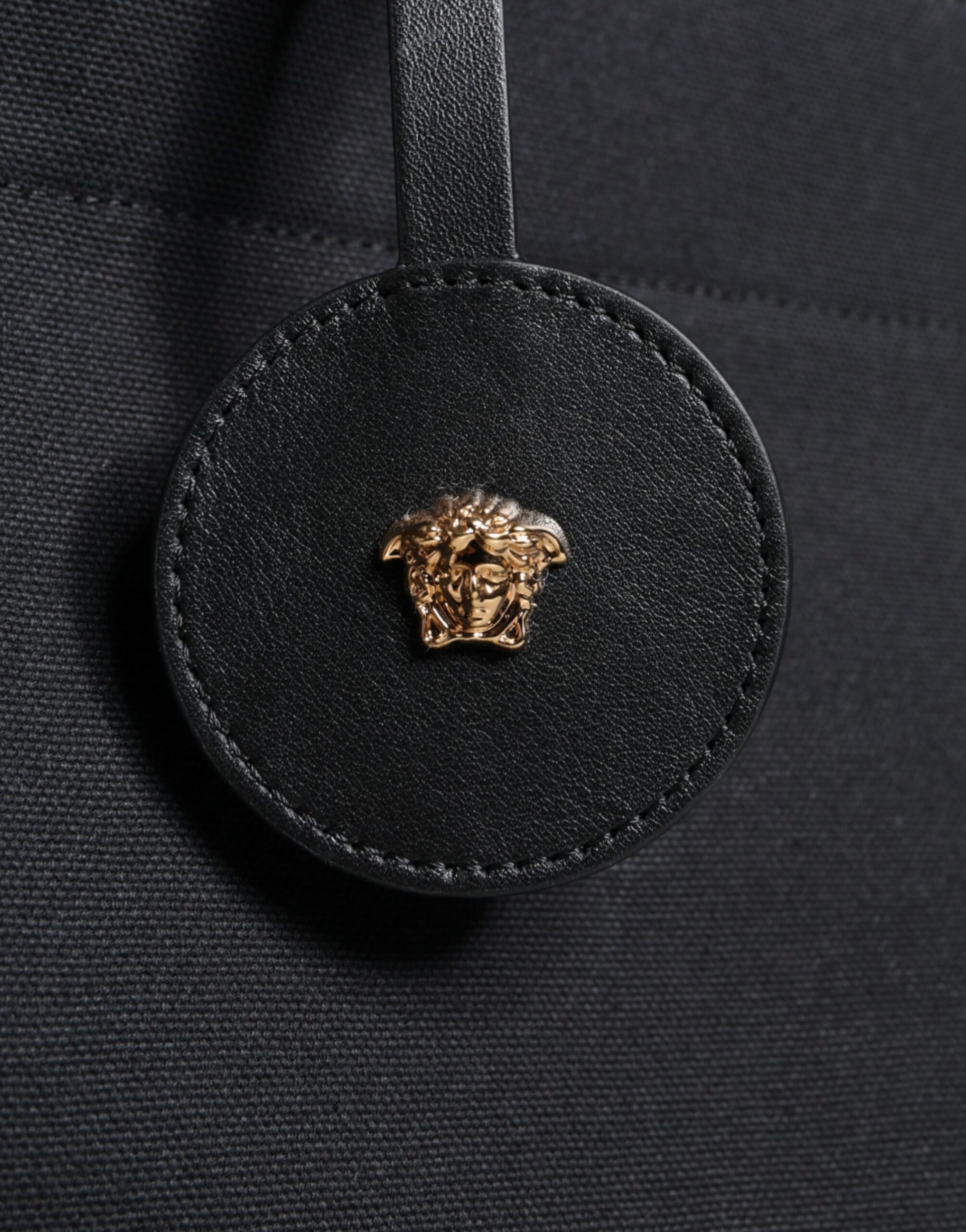 Gold emblem on black fabric