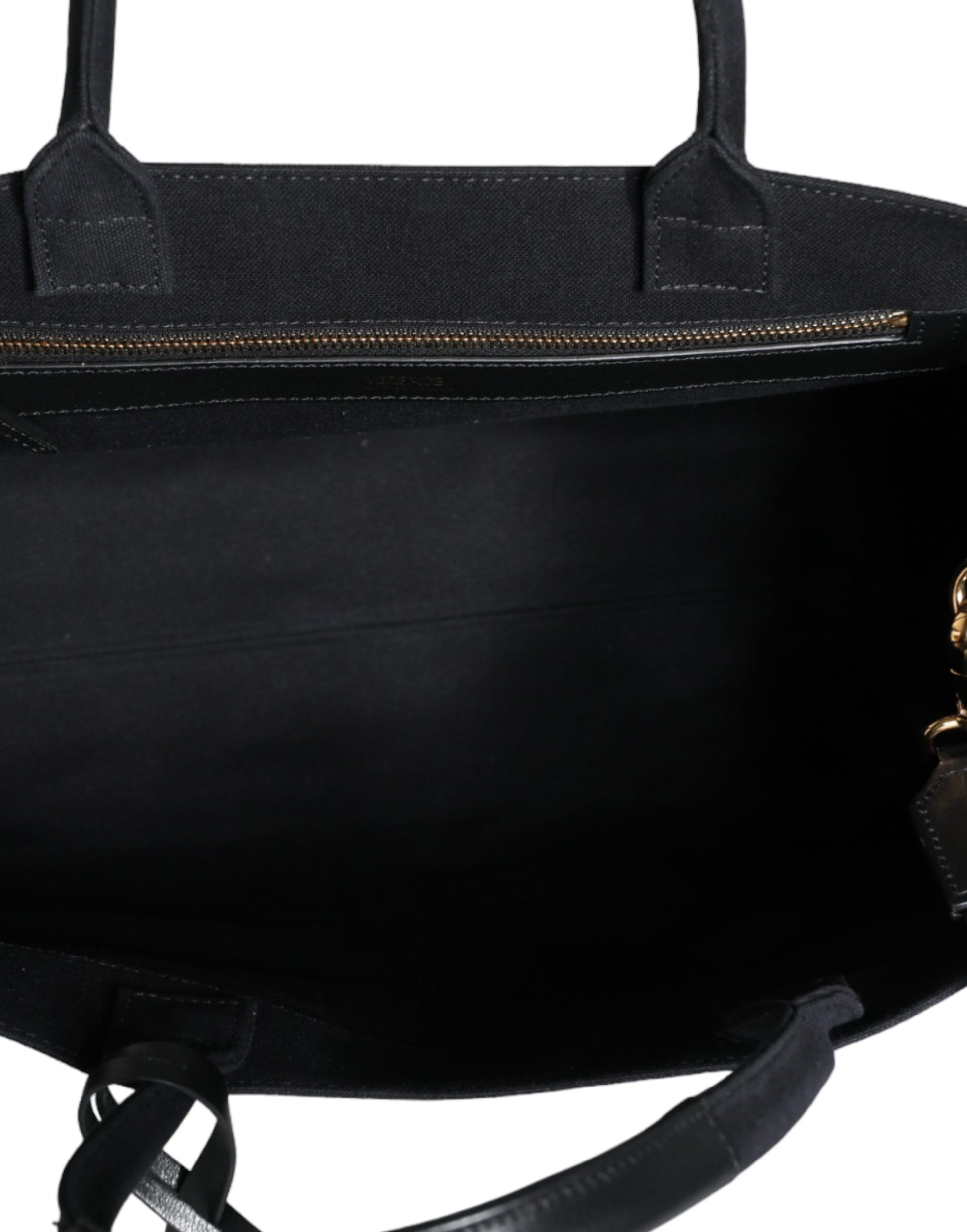 Black leather handbag with gold accents