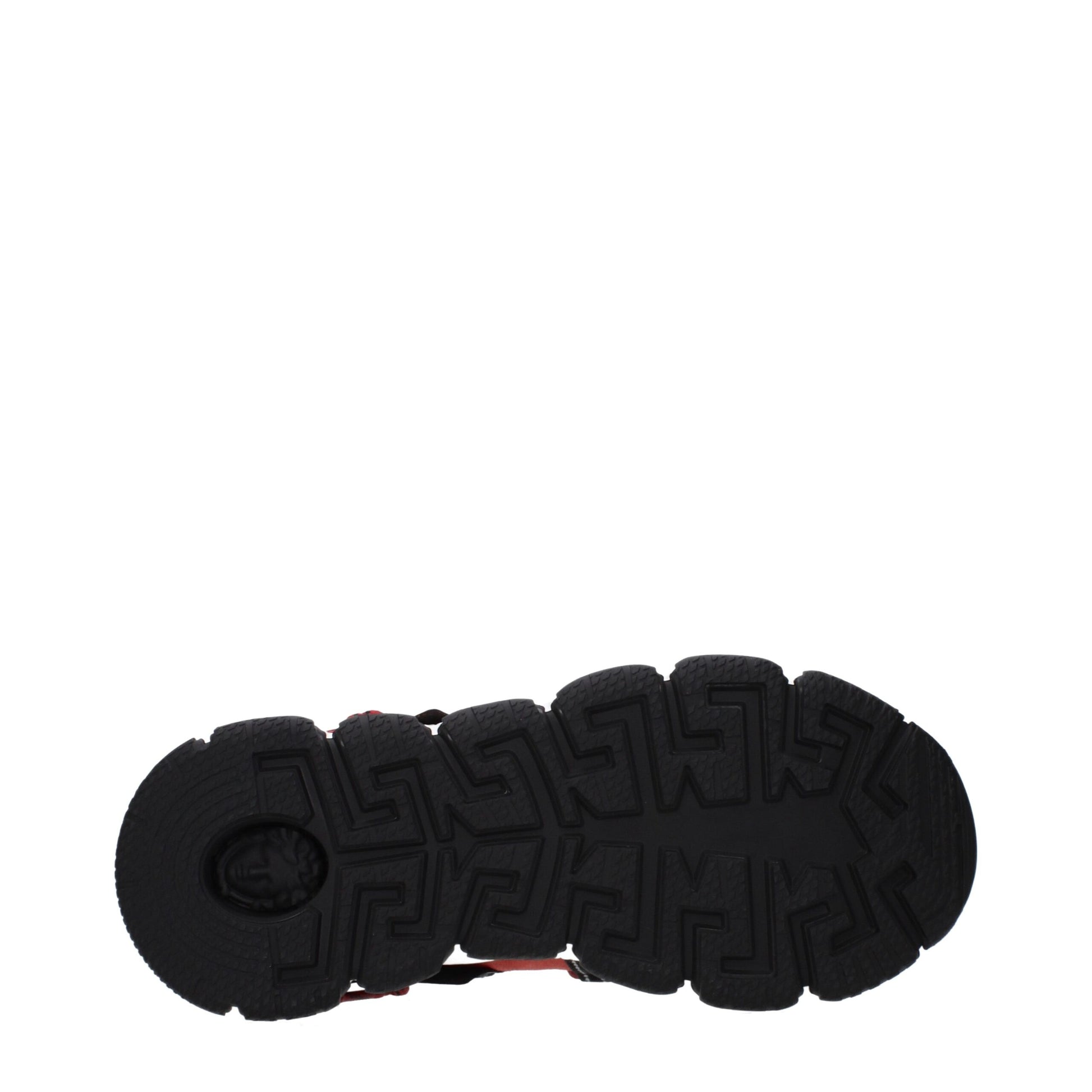 A pair of gray leather chunky sneakers with a distinctive design on the sole