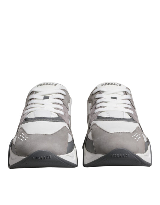 Pair of grey leather sneakers with chunky soles and neoprene details