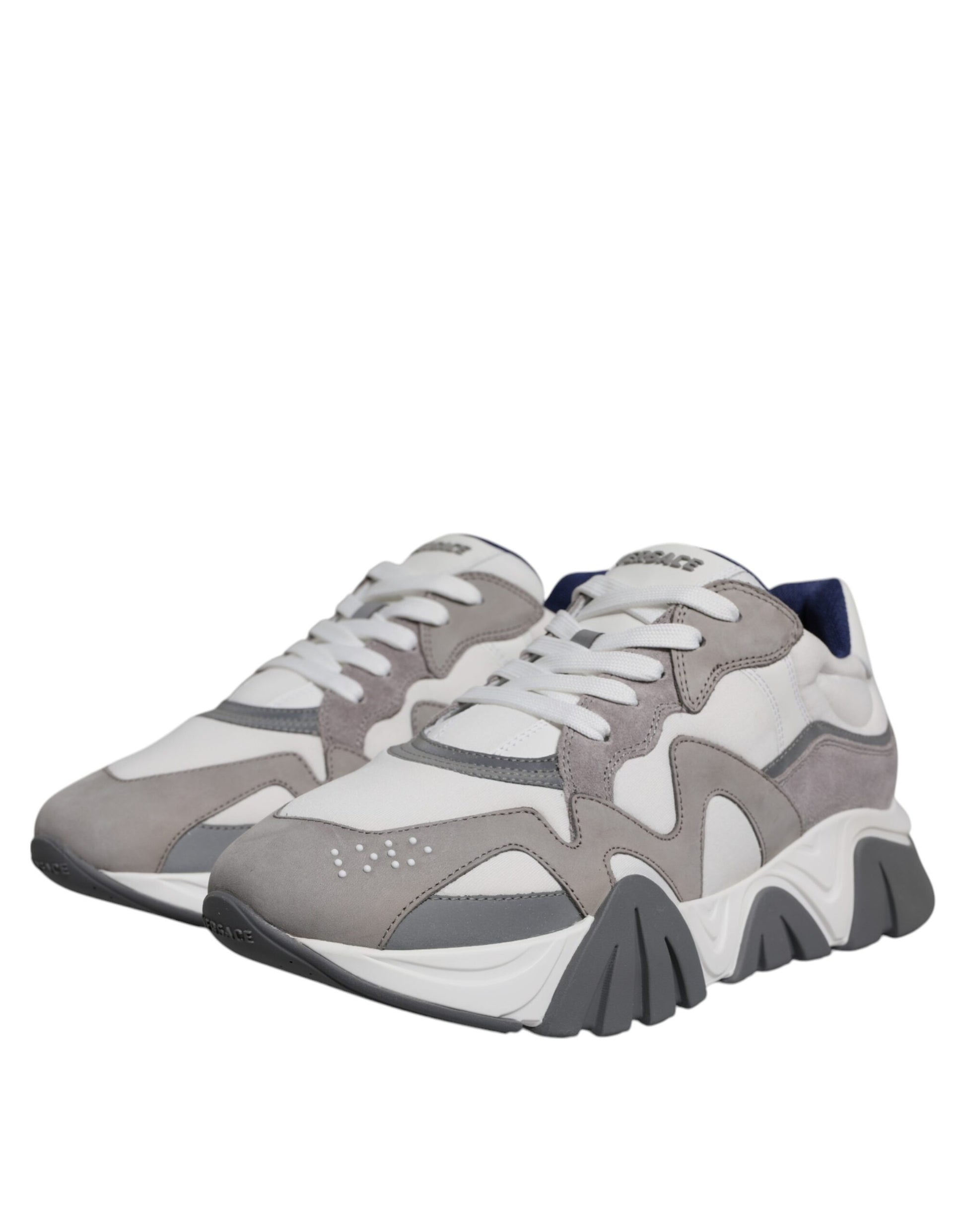 Pair of grey leather sneakers with chunky sole and neoprene upper