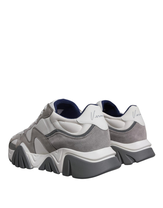 Pair of grey leather sneakers with chunky sole and neoprene upper