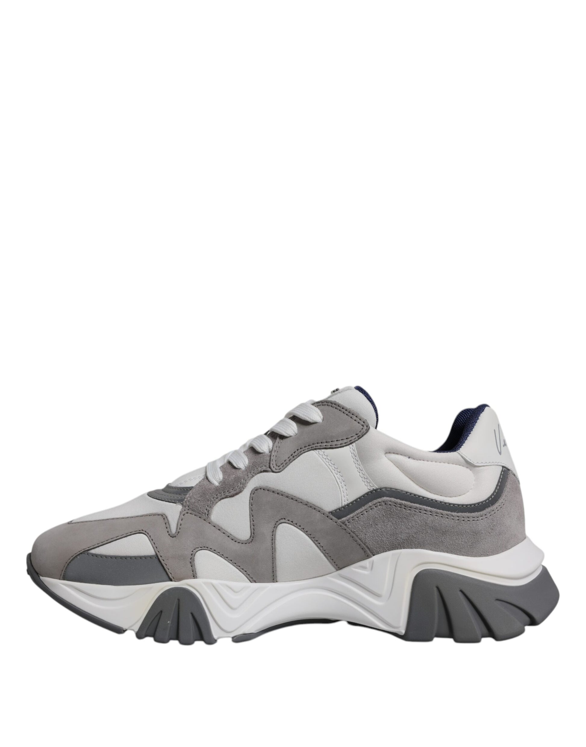 A pair of grey leather sneakers with chunky soles and a low top