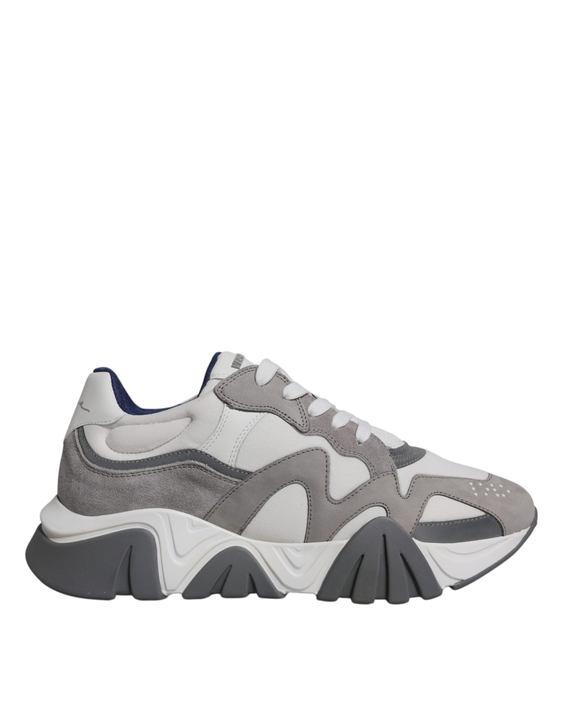 A pair of grey leather sneakers with chunky soles and a low top