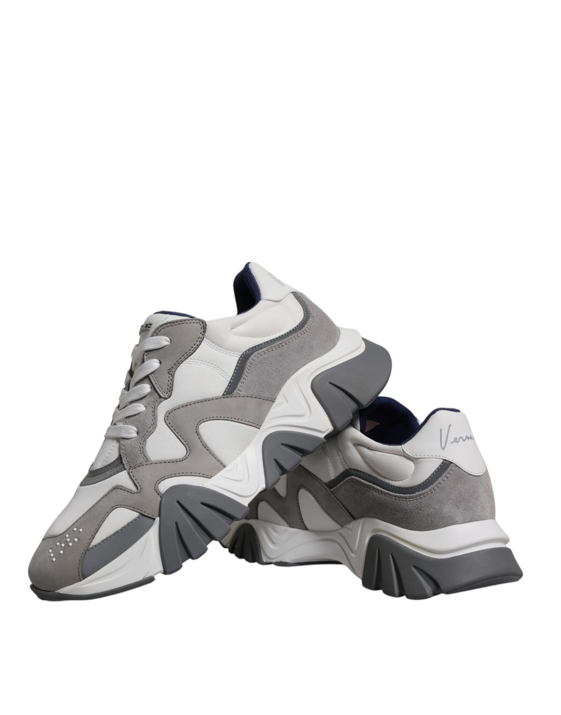 Pair of grey leather sneakers with chunky soles and neoprene accents