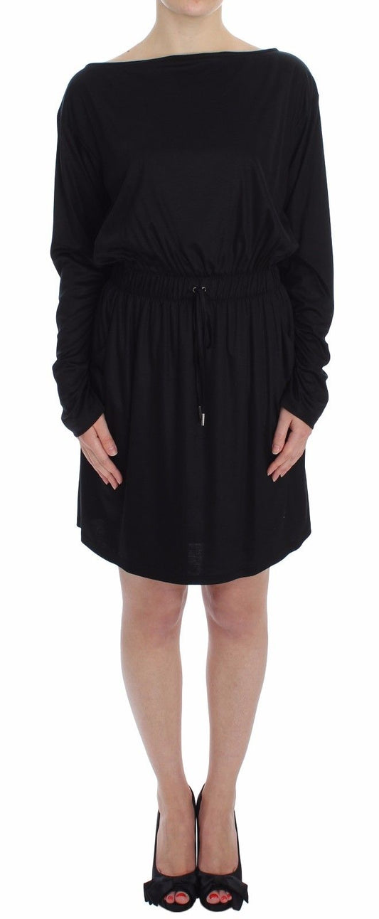 Black dress with long sleeves and ruffled hem