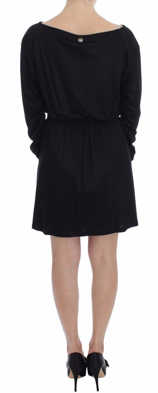 Black dress with ruffled sleeves and hem