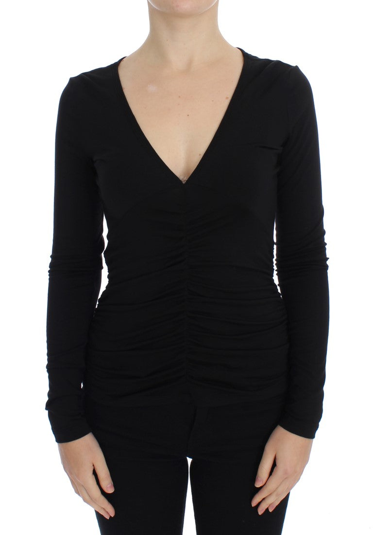 Black long sleeve top with scoop neckline and ruched detailing